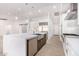 Modern kitchen features a large island, stainless steel appliances, and white cabinets at 35852 N 10Th St, Phoenix, AZ 85086