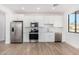 Modern kitchen featuring white cabinets and stainless steel appliances at 35852 N 10Th St, Phoenix, AZ 85086