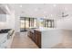 Modern kitchen with island, stainless steel appliances, and white cabinetry at 35852 N 10Th St, Phoenix, AZ 85086