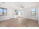 Spacious living room featuring hardwood floors and ceiling fan at 35852 N 10Th St, Phoenix, AZ 85086