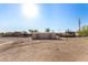 Tan storage shed with double barn doors in a yard at 35852 N 10Th St, Phoenix, AZ 85086