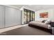 Modern bedroom with gray walls, large windows, and a view of the mountains at 4060 E Lamar Rd, Paradise Valley, AZ 85253