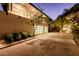 Night view of home's exterior, showcasing modern architecture at 4060 E Lamar Rd, Paradise Valley, AZ 85253