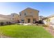 Well-maintained backyard featuring green grass, desert landscaping, and mountain views at 4488 W Charlie Dr, San Tan Valley, AZ 85144