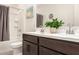 Modern bathroom featuring a double vanity, a separate toilet, and a shower/tub combo at 4488 W Charlie Dr, San Tan Valley, AZ 85144