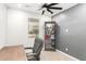 Bedroom featuring a desk, gaming chair, shelving, and a ceiling fan at 4488 W Charlie Dr, San Tan Valley, AZ 85144