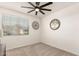 Bedroom with decorative wall decor, a window with blinds, and a ceiling fan at 4488 W Charlie Dr, San Tan Valley, AZ 85144