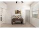 Entryway featuring a decorative console table with doors to the bathroom and a bedroom at 4488 W Charlie Dr, San Tan Valley, AZ 85144