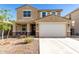 Charming two-story home with a well-maintained front yard and a two-car garage at 4488 W Charlie Dr, San Tan Valley, AZ 85144