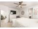 Comfortable main bedroom with white furniture and a ceiling fan at 4488 W Charlie Dr, San Tan Valley, AZ 85144