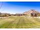 Expansive open field with mountain views, providing ample space for community activities and recreation at 4488 W Charlie Dr, San Tan Valley, AZ 85144