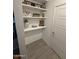 Built-in shelving unit offers ample storage space at 4488 W Charlie Dr, San Tan Valley, AZ 85144