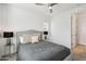 Bright bedroom with gray bedding and double nightstands at 634 E Deer Creek Rd, Phoenix, AZ 85048