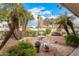 Landscaped backyard with fountain and various plants at 9510 E Jadecrest Dr, Sun Lakes, AZ 85248