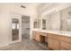 Bathroom with double vanity and a walk-in closet at 9510 E Jadecrest Dr, Sun Lakes, AZ 85248