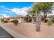 House exterior showcasing desert landscaping and a two-car garage at 9510 E Jadecrest Dr, Sun Lakes, AZ 85248