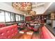 Bright dining area with red booths and wooden tables at 9510 E Jadecrest Dr, Sun Lakes, AZ 85248