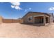 View of the spacious backyard with block wall fence and covered patio, perfect for outdoor activities and entertaining at 18544 E Dario Rd, Gold Canyon, AZ 85118