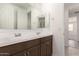 Modern bathroom featuring double sinks, vanity and mirror at 18544 E Dario Rd, Gold Canyon, AZ 85118