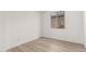 This bedroom features wood-look floors and a window for natural light at 18544 E Dario Rd, Gold Canyon, AZ 85118