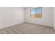 Neutral bedroom with a large window providing natural light and plush carpet at 18544 E Dario Rd, Gold Canyon, AZ 85118