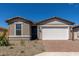 Charming single-story home with a two-car garage and low maintenance desert landscaping at 18544 E Dario Rd, Gold Canyon, AZ 85118