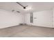 Spacious garage with an automatic door and lighting at 18544 E Dario Rd, Gold Canyon, AZ 85118