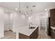 Bright kitchen featuring an island, stainless steel appliances, and a pantry at 18544 E Dario Rd, Gold Canyon, AZ 85118