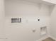 This laundry room has hookups for washer/dryer and a shelf at 18544 E Dario Rd, Gold Canyon, AZ 85118