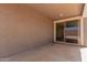 Covered patio with sliding glass door to the interior at 18544 E Dario Rd, Gold Canyon, AZ 85118