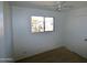 Bright bedroom with a window and neutral wall colors at 1915 E Palmcroft Dr, Tempe, AZ 85282