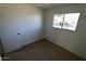 Well-lit bedroom featuring carpet and a window at 1915 E Palmcroft Dr, Tempe, AZ 85282