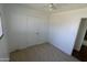 Spacious bedroom with carpeted floor and door at 1915 E Palmcroft Dr, Tempe, AZ 85282