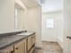 This bathroom features a single sink vanity and a shower/tub combo at 41735 N 260Th Ave, Morristown, AZ 85342