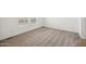 A bright bedroom with neutral colored carpet and baseboards at 41735 N 260Th Ave, Morristown, AZ 85342