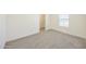The bedroom has neutral carpet and a large window for natural lighting at 41735 N 260Th Ave, Morristown, AZ 85342