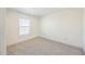 The bedroom has carpeted floors and a large window for plenty of natural light at 41735 N 260Th Ave, Morristown, AZ 85342