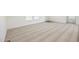 Spacious living area featuring soft carpeting and bright natural light from the window at 41735 N 260Th Ave, Morristown, AZ 85342