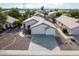 Single-story house with two-car garage, and desert landscaping at 8549 W El Caminito Dr, Peoria, AZ 85345