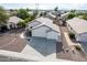 Single-story home with a two-car garage and a gravel driveway at 8549 W El Caminito Dr, Peoria, AZ 85345