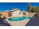 Backyard featuring a swimming pool, patio, and rock landscaping at 8549 W El Caminito Dr, Peoria, AZ 85345