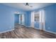 Bedroom with mirrored closet doors and light blue walls at 8549 W El Caminito Dr, Peoria, AZ 85345