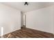 A clean bedroom with wood-look flooring, white walls, and a neutral color palette at 8549 W El Caminito Dr, Peoria, AZ 85345