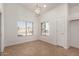 Cozy dining area with large windows and a modern chandelier at 8549 W El Caminito Dr, Peoria, AZ 85345