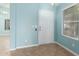 Interior entryway with light blue walls and tile flooring at 8549 W El Caminito Dr, Peoria, AZ 85345