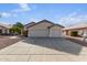 Front view of a house with a two-car garage at 8549 W El Caminito Dr, Peoria, AZ 85345