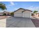 House exterior showcasing a two-car garage at 8549 W El Caminito Dr, Peoria, AZ 85345