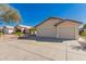 Attractive home with a spacious driveway and a two-car garage at 8549 W El Caminito Dr, Peoria, AZ 85345