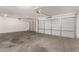 Garage with two car doors and a concrete floor at 8549 W El Caminito Dr, Peoria, AZ 85345