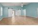 Spacious living area with barn doors and tile floors at 8549 W El Caminito Dr, Peoria, AZ 85345